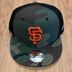 New Era Camouflage Snapback with Orange Emblem